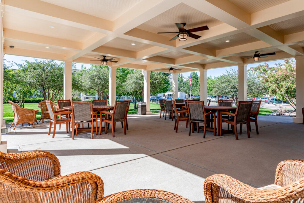 Community Center patio, wicker chairs and tables and ceiling fans