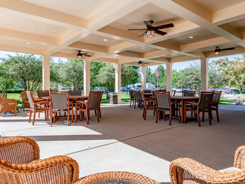 Community Center patio, wicker chairs and tables and ceiling fans